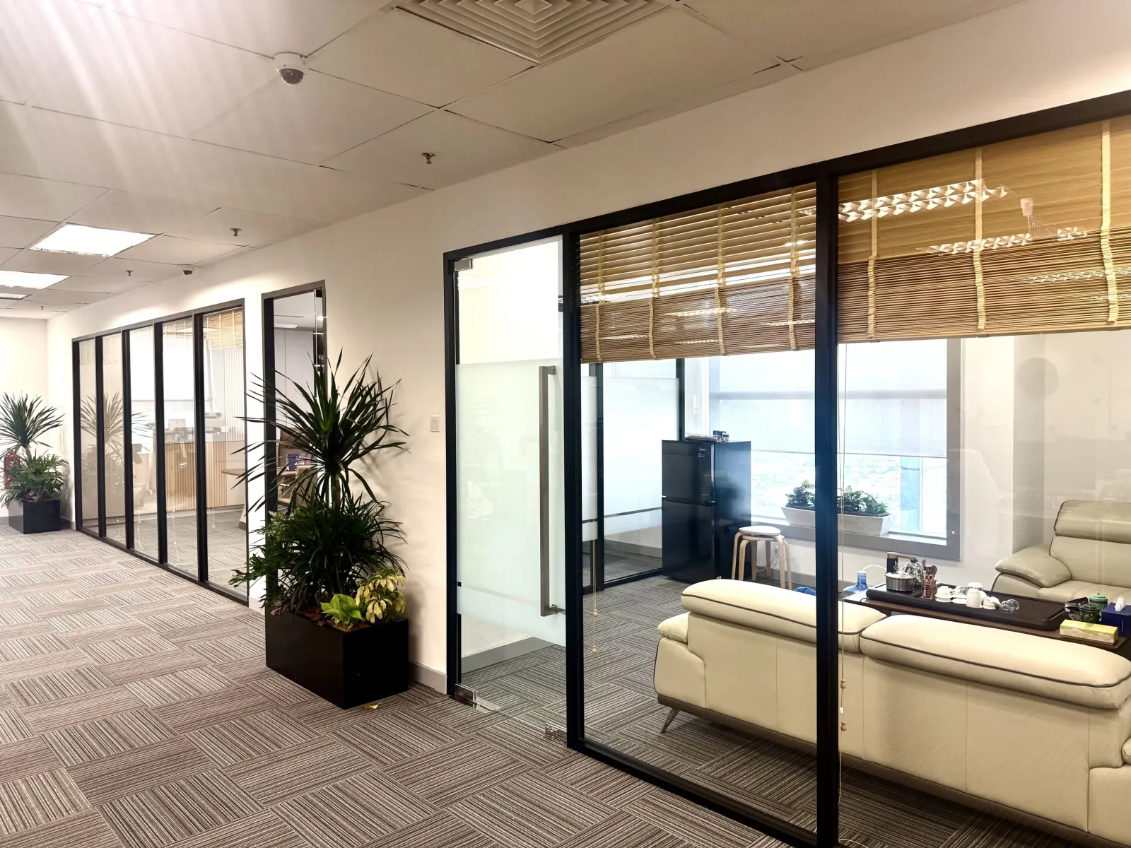 Glass-partitioned lounge area at Cosco Shipping Lines