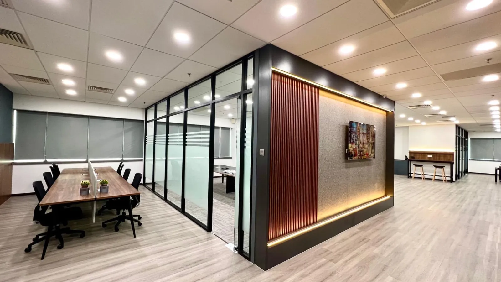 Meeting room with glass partition and timber feature wall at HR Tag