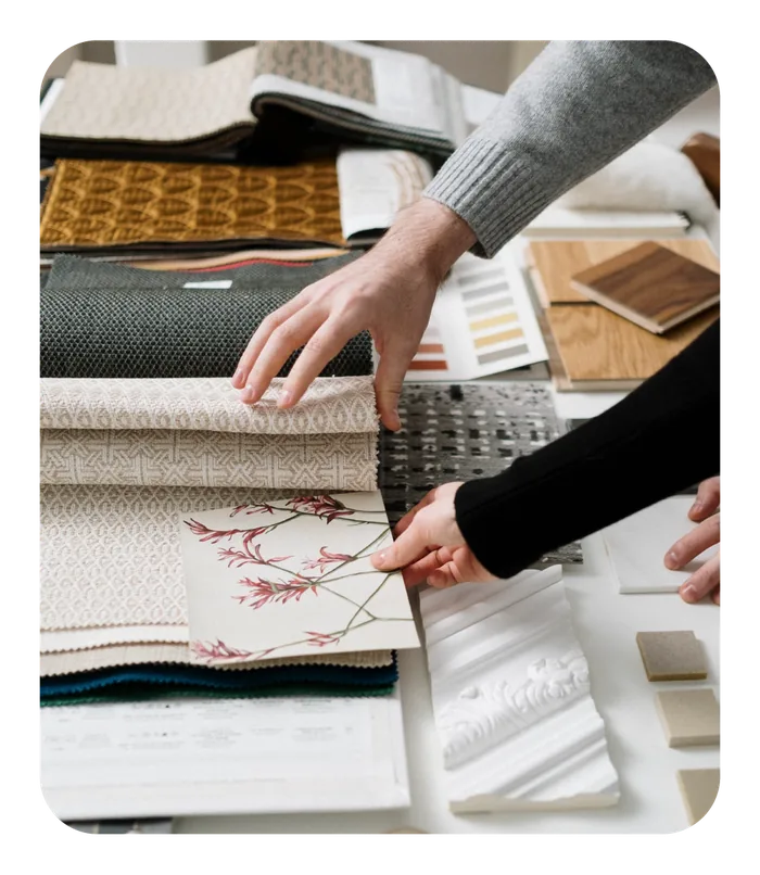 Designer comparing fabric and material samples